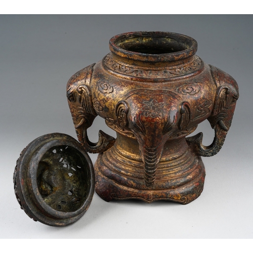 164 - A Chinese gilt bronze censer, the domed lid with recumbent elephant above foliate pierced design, th... 