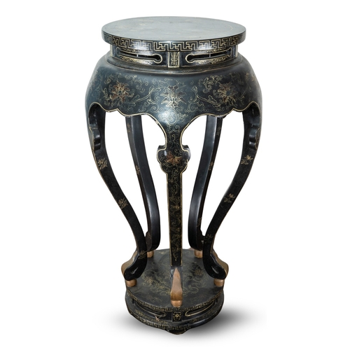 169 - A Chinese black lacquered and gilt papier mache display table, of circular form, wavy apron, on five... 
