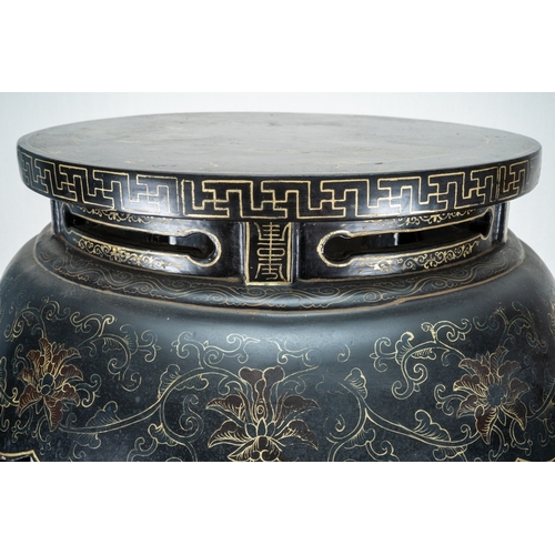 169 - A Chinese black lacquered and gilt papier mache display table, of circular form, wavy apron, on five... 