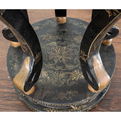 169 - A Chinese black lacquered and gilt papier mache display table, of circular form, wavy apron, on five... 