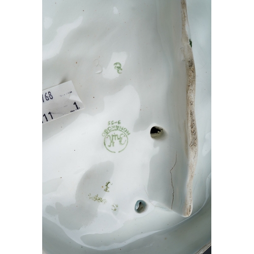 170 - A 20th century Russian figure group of two boys dressed in Winter clothes, carrying bird boxes and w... 