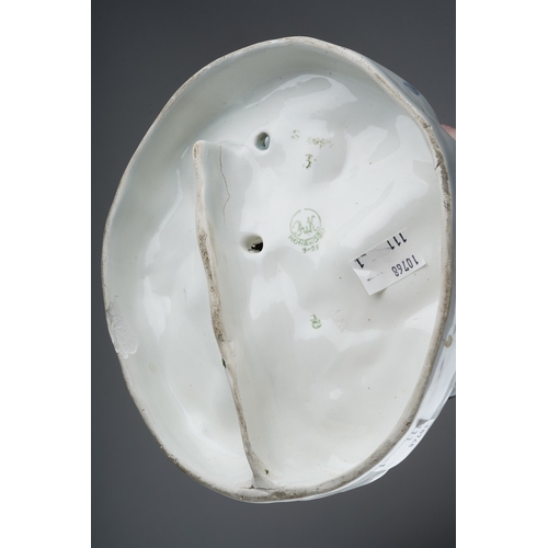 170 - A 20th century Russian figure group of two boys dressed in Winter clothes, carrying bird boxes and w... 