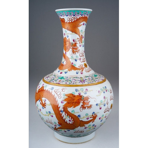 173 - A 20th century Chinese porcelain onion shaped famille rose vase, enamelled with three iron red five ... 