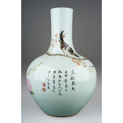 175 - A large Chinese Republic vase enamelled with two birds amongst branches and blossom, script and seal... 