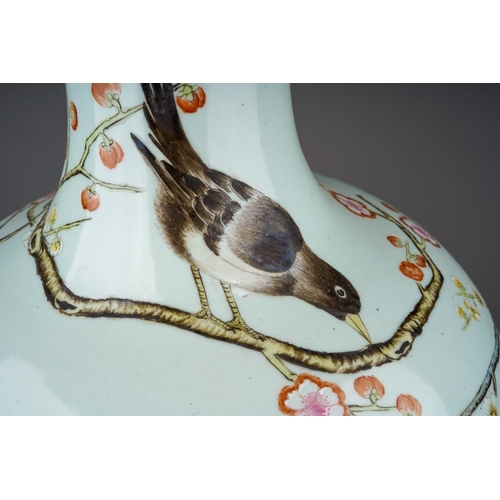 175 - A large Chinese Republic vase enamelled with two birds amongst branches and blossom, script and seal... 