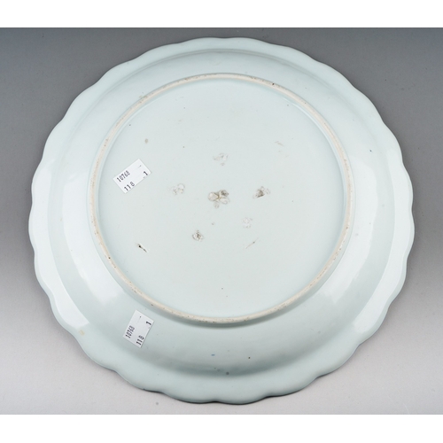 177 - A Japanese Arita porcelain blue and white scallop edged plate, possibly late 17th century, decorated... 