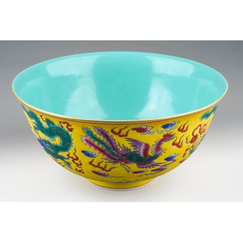183 - A 20th century Chinese famille rose footed bowl on a yellow ground, turquoise interior, enamelled wi... 