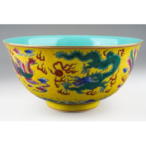 183 - A 20th century Chinese famille rose footed bowl on a yellow ground, turquoise interior, enamelled wi... 