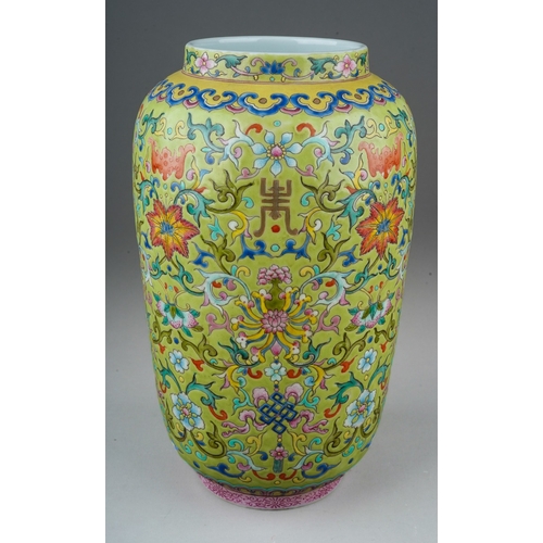 188 - A Chinese Famille Rose baluster vase polychrome enamelled on a light green ground, decorated with ba... 