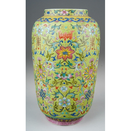 188 - A Chinese Famille Rose baluster vase polychrome enamelled on a light green ground, decorated with ba... 