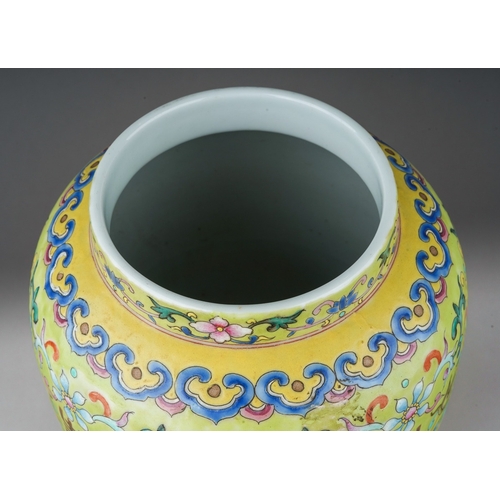 188 - A Chinese Famille Rose baluster vase polychrome enamelled on a light green ground, decorated with ba... 