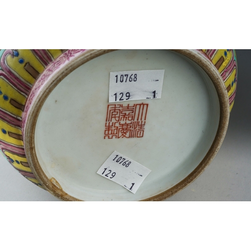 188 - A Chinese Famille Rose baluster vase polychrome enamelled on a light green ground, decorated with ba... 