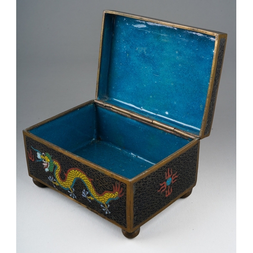 201 - A 20th century Chinese cloisonne rectangular box with pull off cover, the black ground decorated wit... 