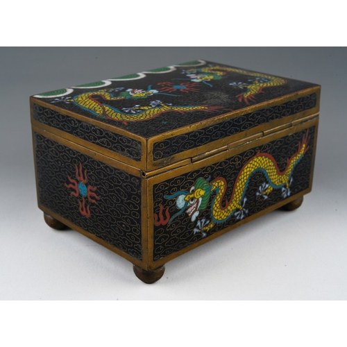 201 - A 20th century Chinese cloisonne rectangular box with pull off cover, the black ground decorated wit... 