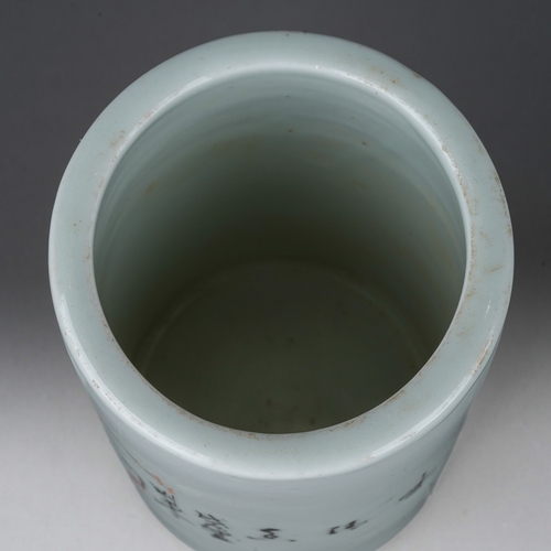 203 - A 20th century Chinese porcelain brush pot of cylindrical form, painted with a bird in a flowering b... 