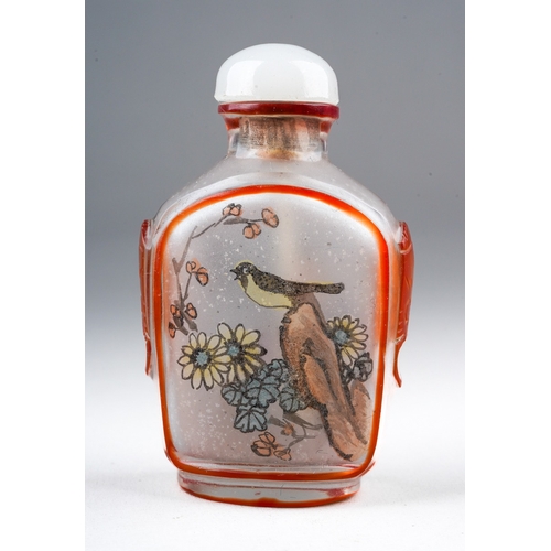 205 - A 20th century Chinese glass snuff bottle, reverse painted with a seated female and a bird on a rock... 