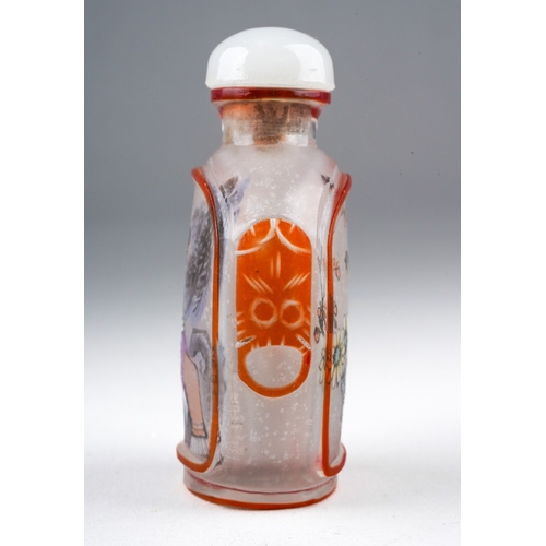 205 - A 20th century Chinese glass snuff bottle, reverse painted with a seated female and a bird on a rock... 