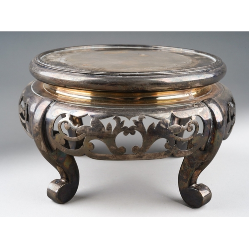 209 - A Walker & Hall silver plated circular display stand in the Chinese taste, pierced apron and on four... 