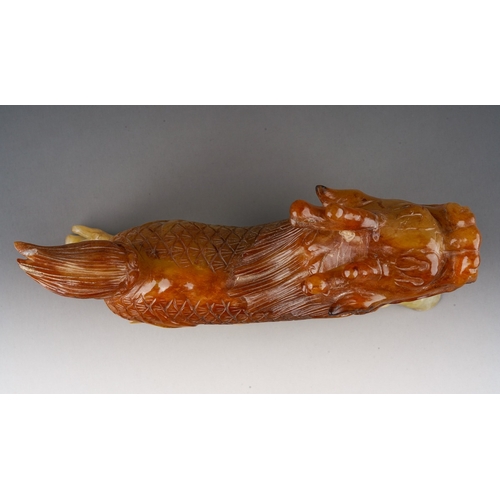 211 - A Chinese jadeite Foo dog carved as walking, length 21cm x height 14.5cm