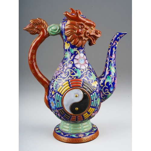 213 - A late 20th / early 21st century polychrome stoneware dragon wine pot, of baluster form, handle in t... 