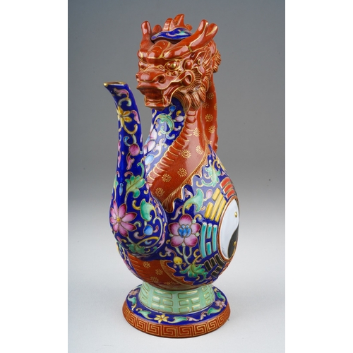 213 - A late 20th / early 21st century polychrome stoneware dragon wine pot, of baluster form, handle in t... 