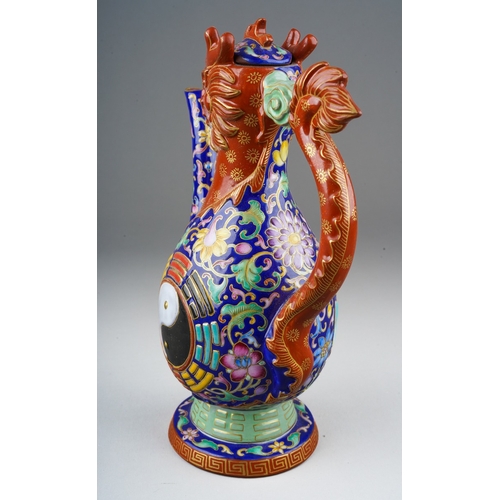 213 - A late 20th / early 21st century polychrome stoneware dragon wine pot, of baluster form, handle in t... 