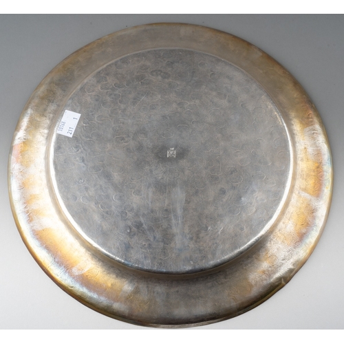 228 - A Japanese silver salver of circular form with upturned rim, patterned surface, engraved monogram, b... 