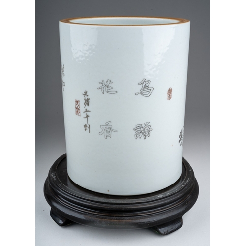 235 - A 20th century Chinese porcelain brush pot of cylindrical form, the monochrome decoration of a bird ... 