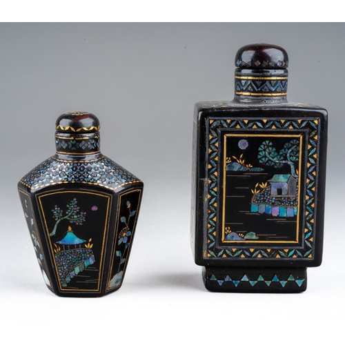 236 - Two Chinese papier mache gilt and mother of pearl inlaid snuff bottles, both with landscape scenes, ... 