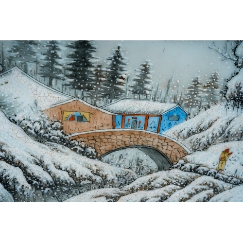 240 - A 20th century Chinese porcelain panel, painted with a snow scene of a figure by a bridge and dwelli... 