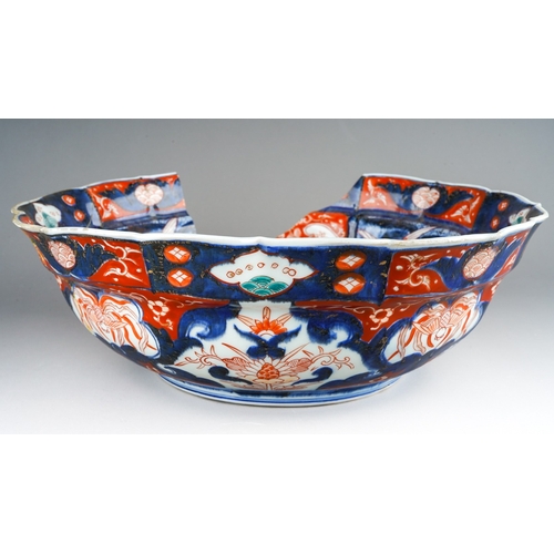 248 - A 19th century Japanese Imari bowl of panelled circular form, wavy rim, four character mark to under... 