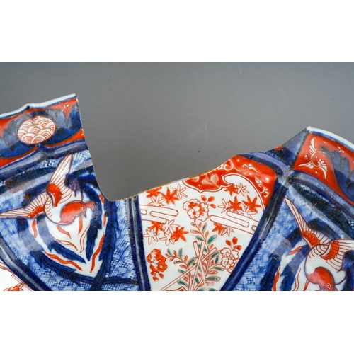 248 - A 19th century Japanese Imari bowl of panelled circular form, wavy rim, four character mark to under... 