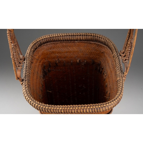 249 - A Japanese finely woven wicker Ikebana basket with carrying handle, of tapered square outline, heigh... 