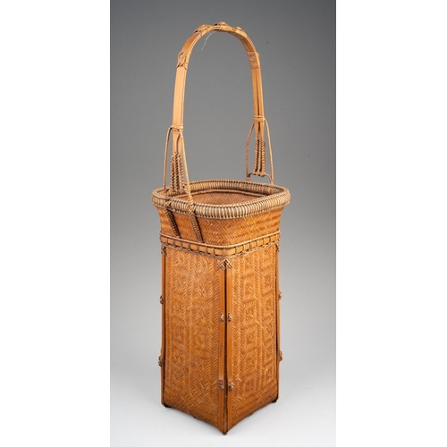 249 - A Japanese finely woven wicker Ikebana basket with carrying handle, of tapered square outline, heigh... 