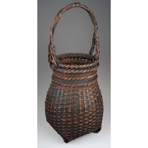 250 - A Japanese woven wicker Ikebana basket with carrying handle, height 46cm x diameter of exterior of n... 