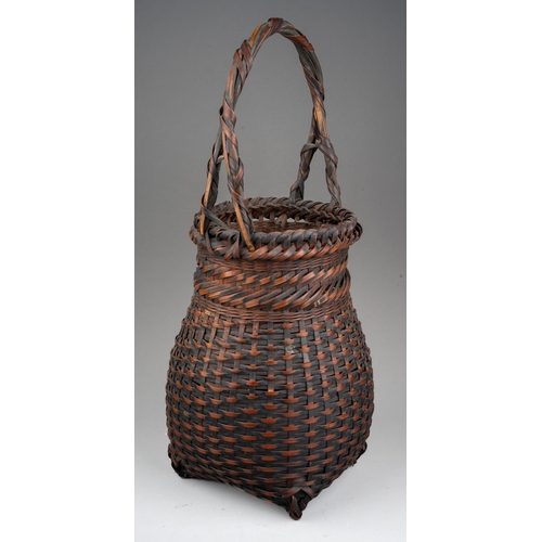 250 - A Japanese woven wicker Ikebana basket with carrying handle, height 46cm x diameter of exterior of n... 