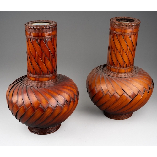 253 - A pair of modern Japanese woven wicker Ikebana style vases with ceramic liners, height 30cm (2)