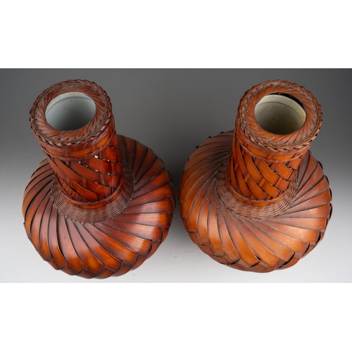 253 - A pair of modern Japanese woven wicker Ikebana style vases with ceramic liners, height 30cm (2)