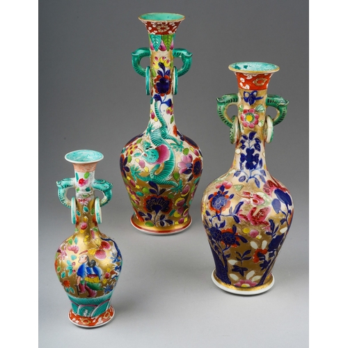 264 - Three early 19th century Miles Mason Ironstone vases of twin handled baluster form, each with flared... 