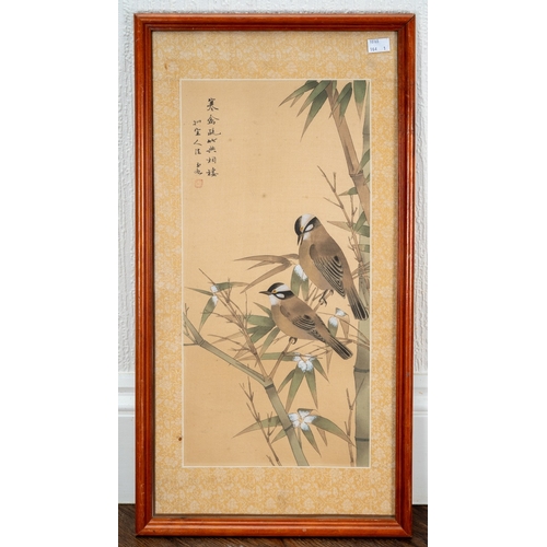 279 - A late 20th century Chinese painting on silk of two birds in bamboo, fabric mount, framed and glazed... 