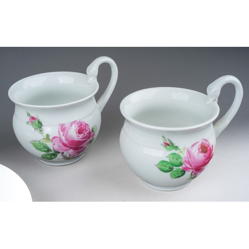 290 - Two Meissen demi-tasse cups with swans head handles, painted with pink roses and rose buds, blue cro... 