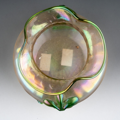 291 - An early 20th century Loetz style iridescent glass vase of squat ribbed form, green rim and applied ... 