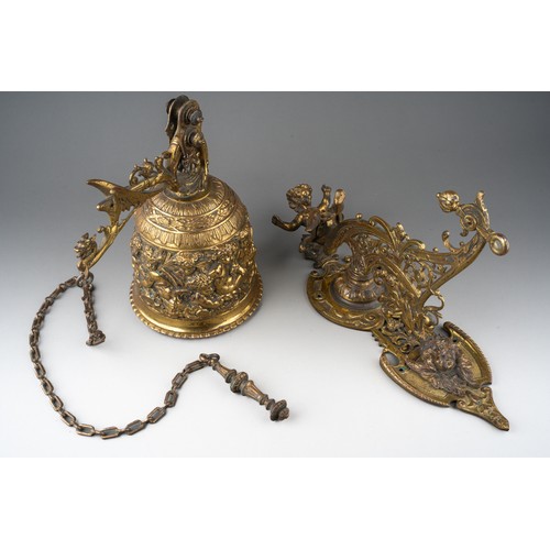 316 - A late 19th century bronze bell and wall hanging bracket, ornately cast with cherubs and scrolls, wi... 