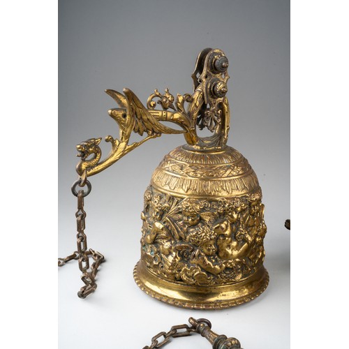 316 - A late 19th century bronze bell and wall hanging bracket, ornately cast with cherubs and scrolls, wi... 