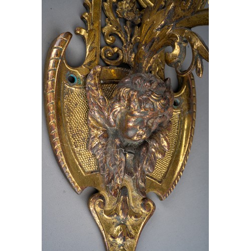 316 - A late 19th century bronze bell and wall hanging bracket, ornately cast with cherubs and scrolls, wi... 