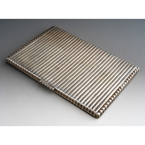 320 - An early 20th Century Continental silver cigarette case, ridged detail to entire, hallmarked to inte... 