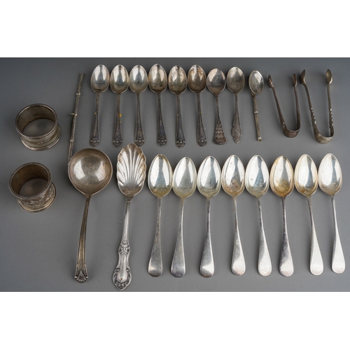 321 - A collection of silver flatware mainly teaspoons and two napkin ring, various dates and makers, gros... 