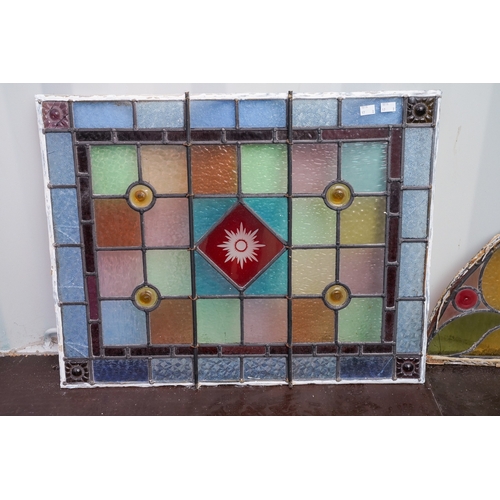 466 - Two late Victorian / Edwardian leaded coloured glass window panels, one of arch shape, 84cm x 40cm, ... 