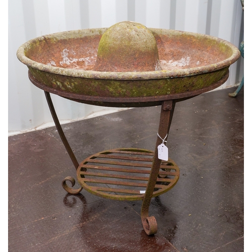 467 - A cast iron circular Mexican hat pig trough, fitted on a separate circular base, diameter 70cm x hei... 