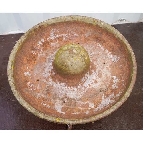 467 - A cast iron circular Mexican hat pig trough, fitted on a separate circular base, diameter 70cm x hei... 